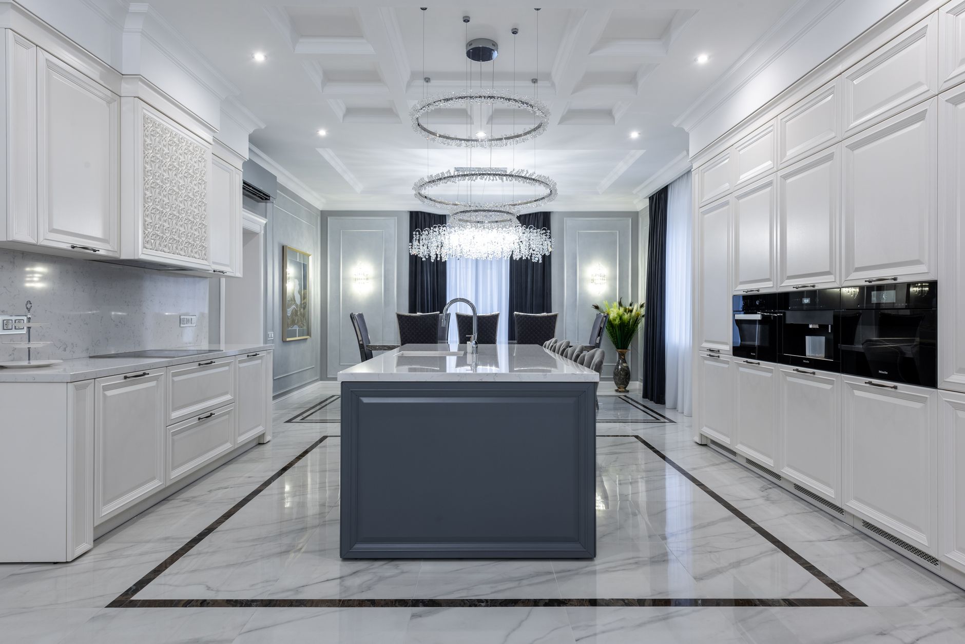 Interior of contemporary spacious kitchen with light expensive furniture placed in apartment with in Riverside, CA